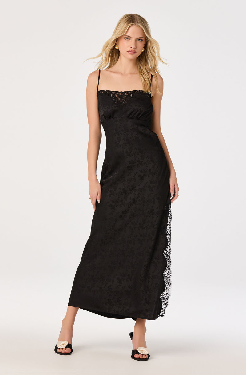 Black slip dress with lace trim and spaghetti straps.