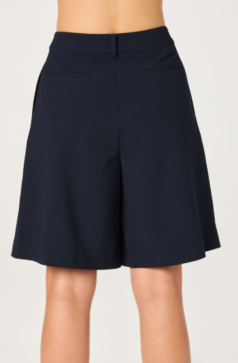 Navy wide-leg shorts with a high waist and front pleats.