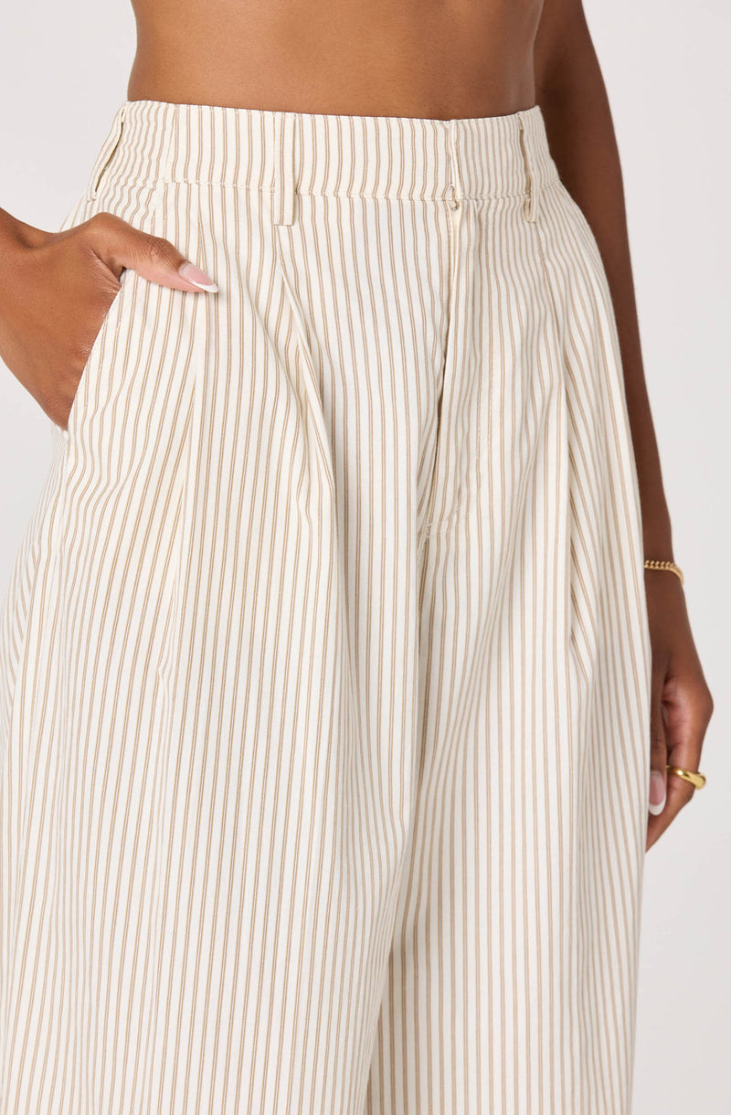 High-waisted cream-colored pants with thin, vertical brown stripes.