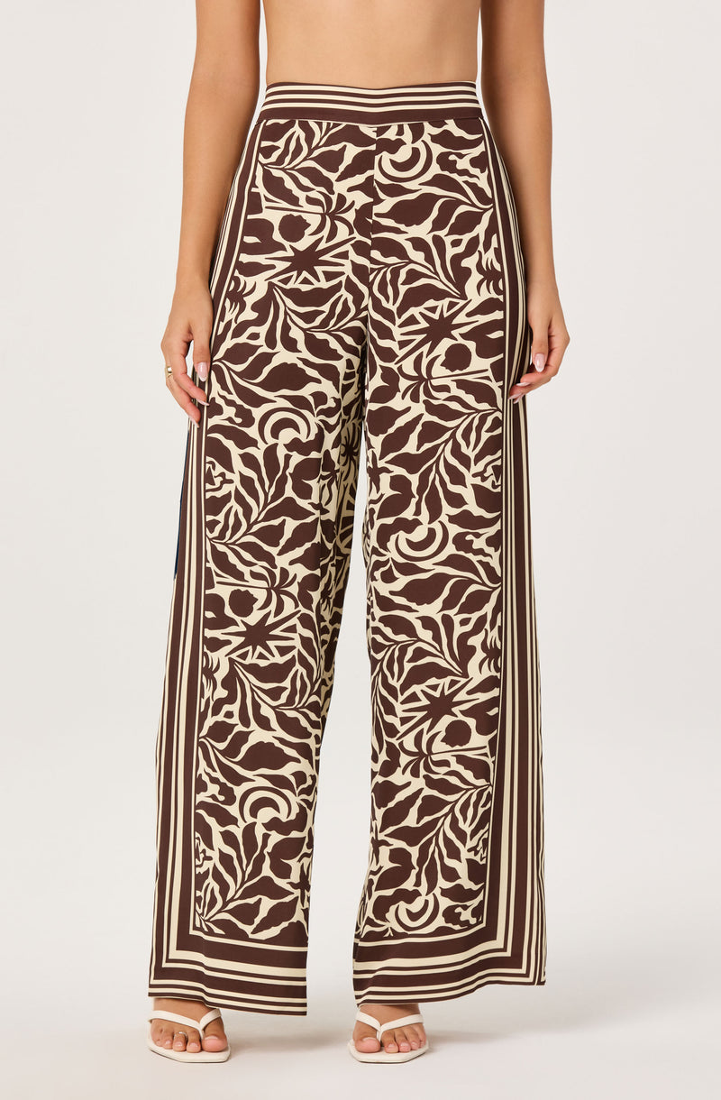 Wide-leg pants with a brown and beige floral print, striped waistband, and side stripes.
