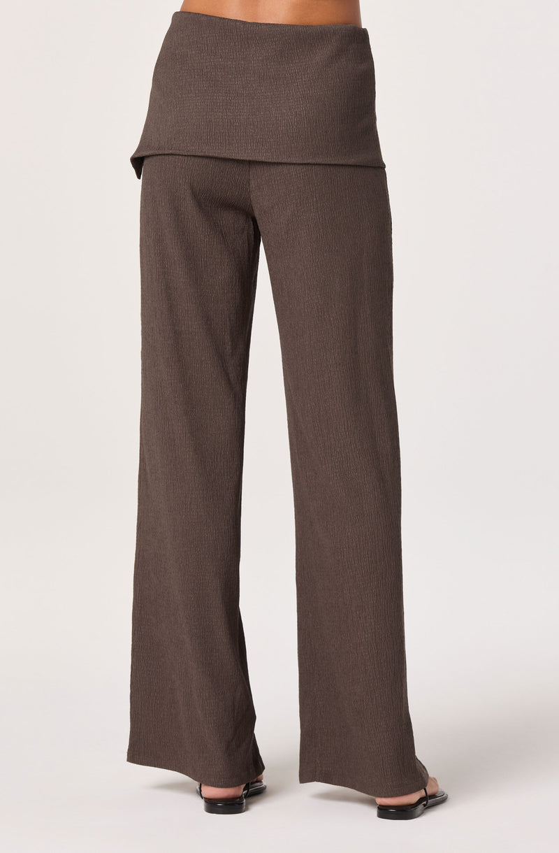 Brown wide-leg pants with a matching wide waistband.