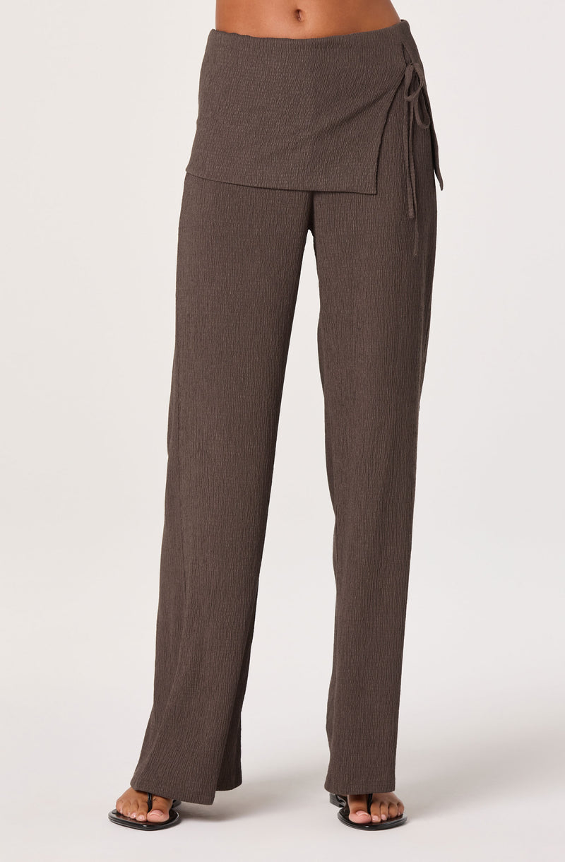 Brown ribbed knit pants with a side tie detail at the waist.