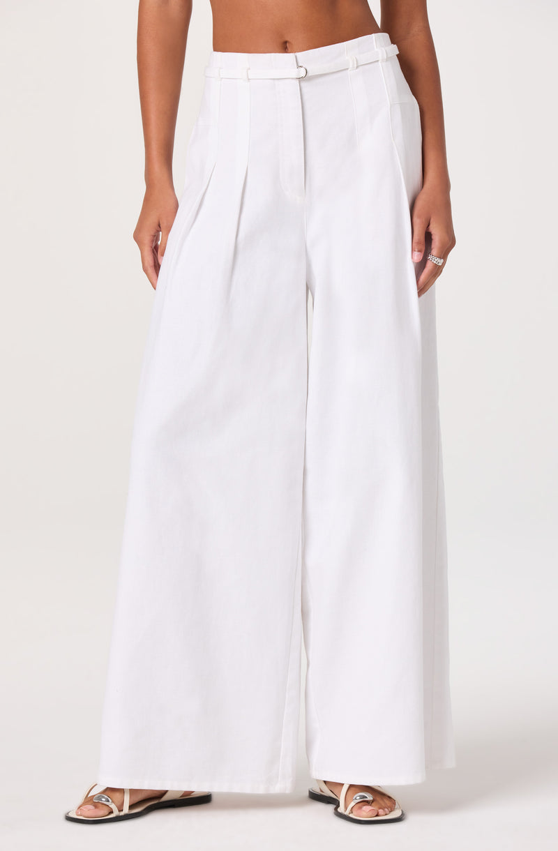 White wide-leg high-waisted trousers with pleats and a belt.