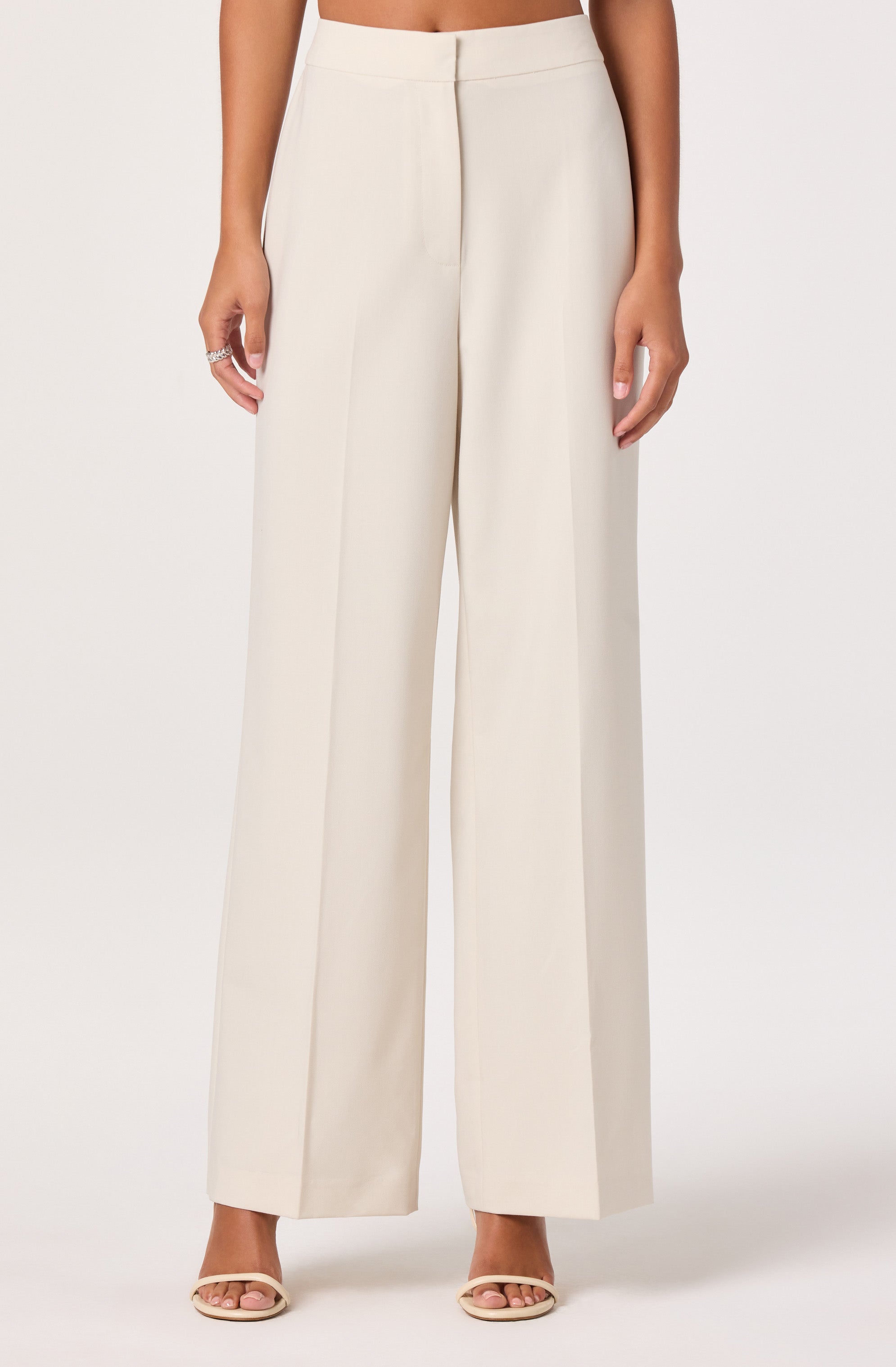 White wide-leg trousers with a high waist.