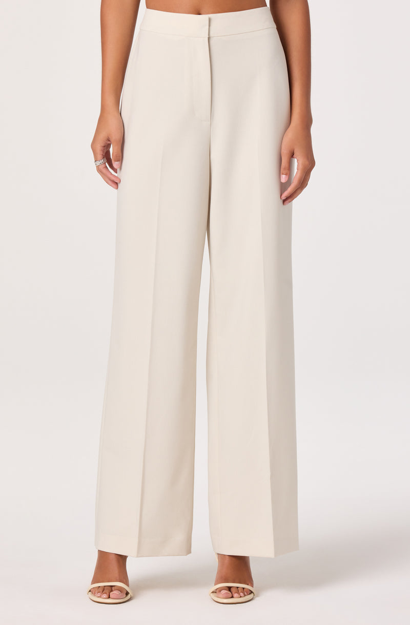White wide-leg trousers with a high waist.