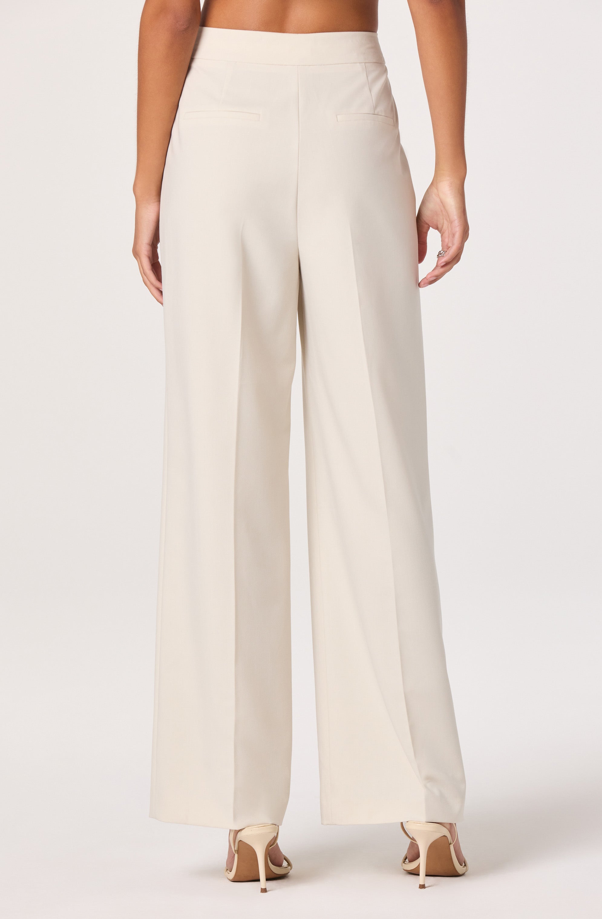 Wide-leg cream dress pants.