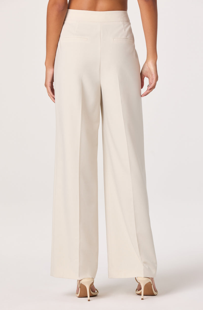 Wide-leg cream dress pants.