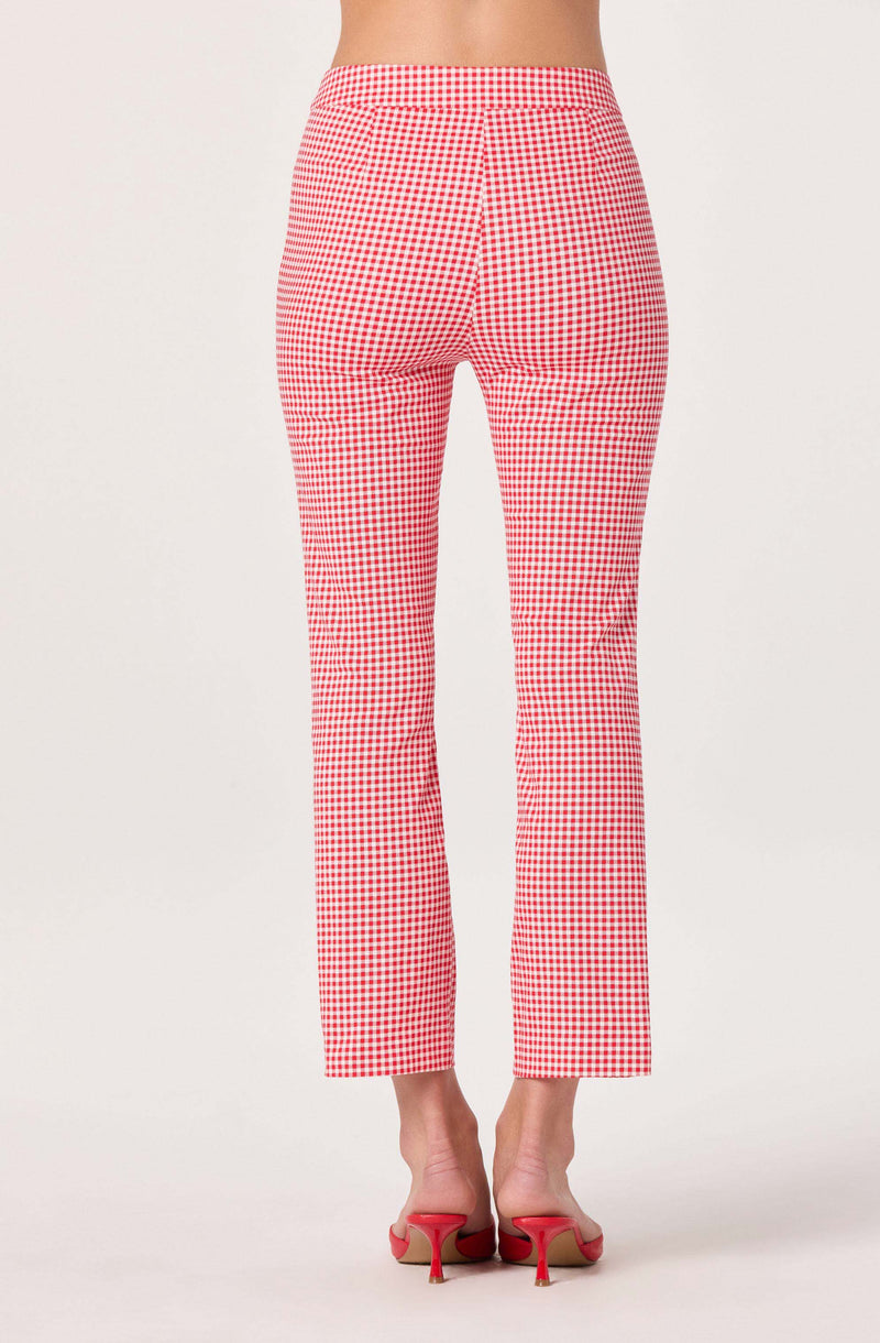 Red and white checkered pants with a fitted waist and straight legs, paired with pink high-heeled shoes.