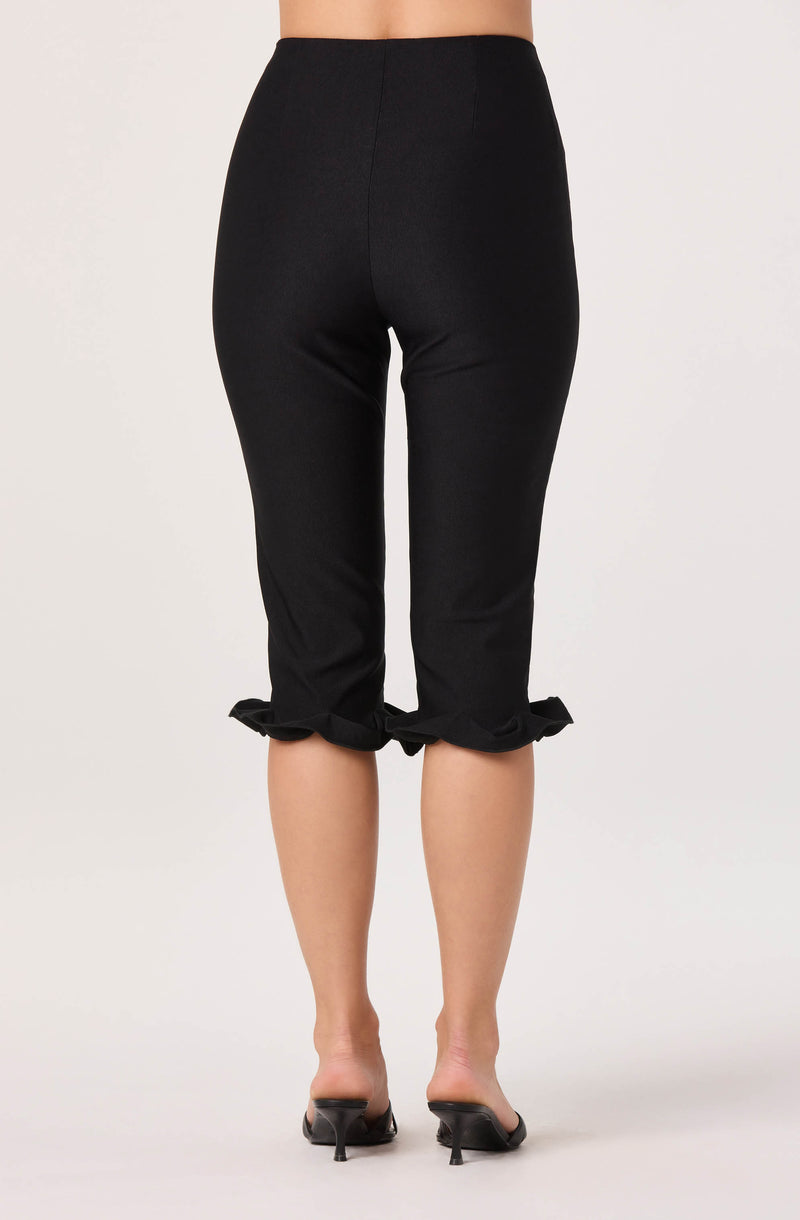 Black cropped pants with ruffled hem, high waist, fitted style.