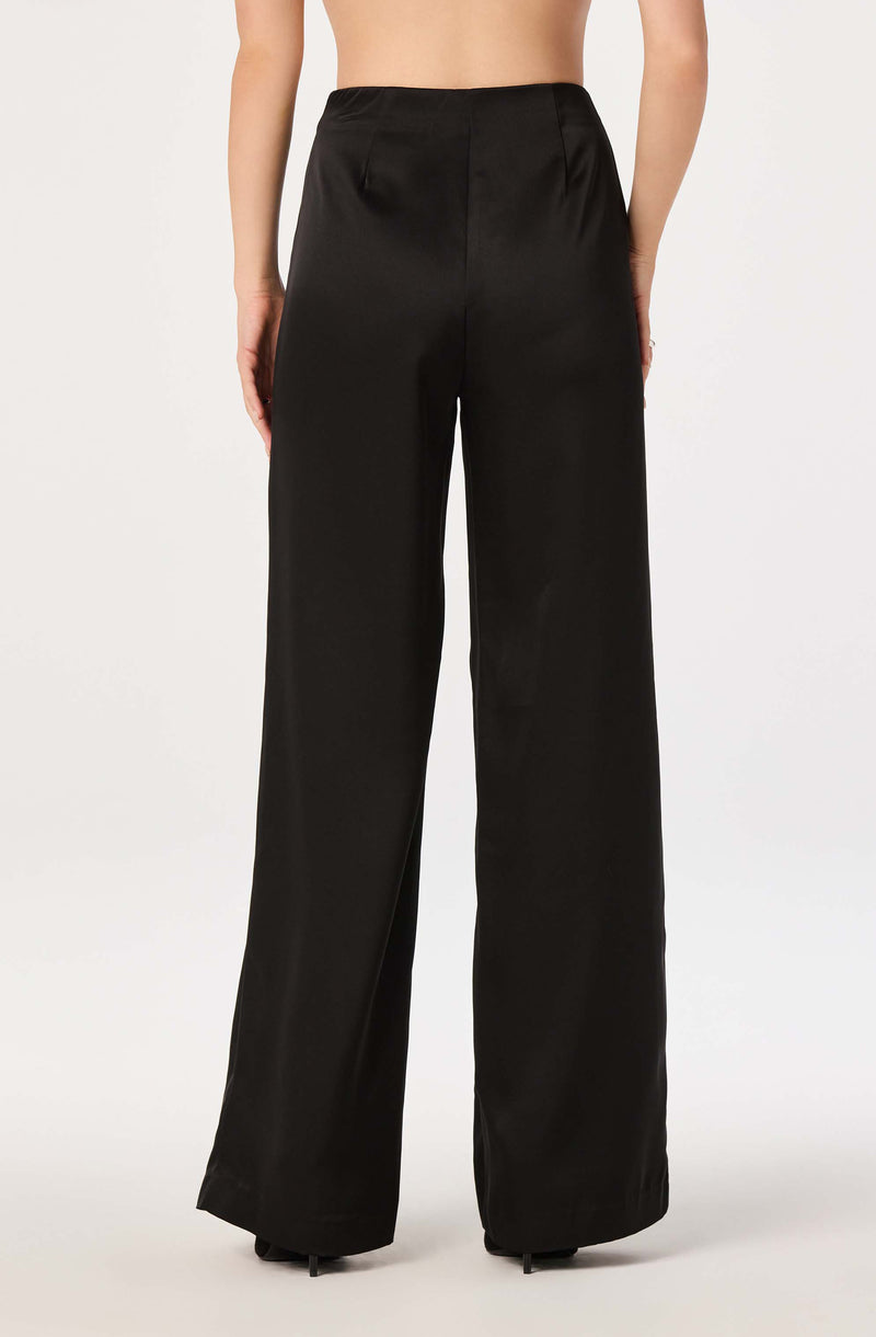 Woman's high-waisted black wide-leg satin pants.