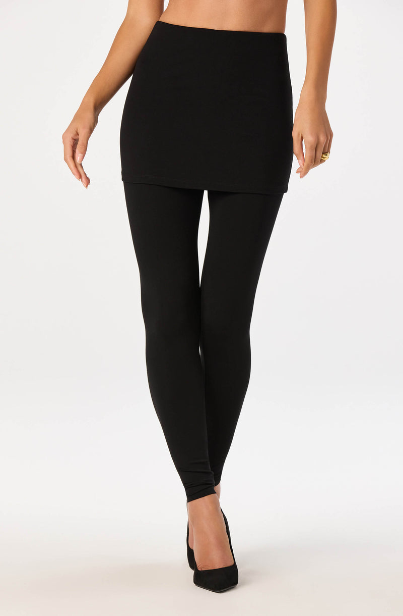 Black high-waisted skirt paired with black leggings and black high heels.