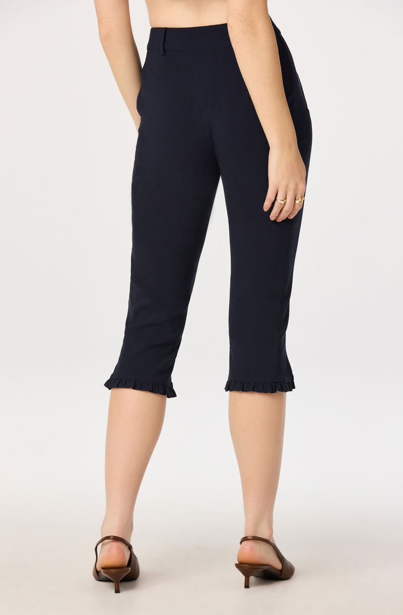 Navy cropped pants with ruffled hems, high waist, and side pockets.