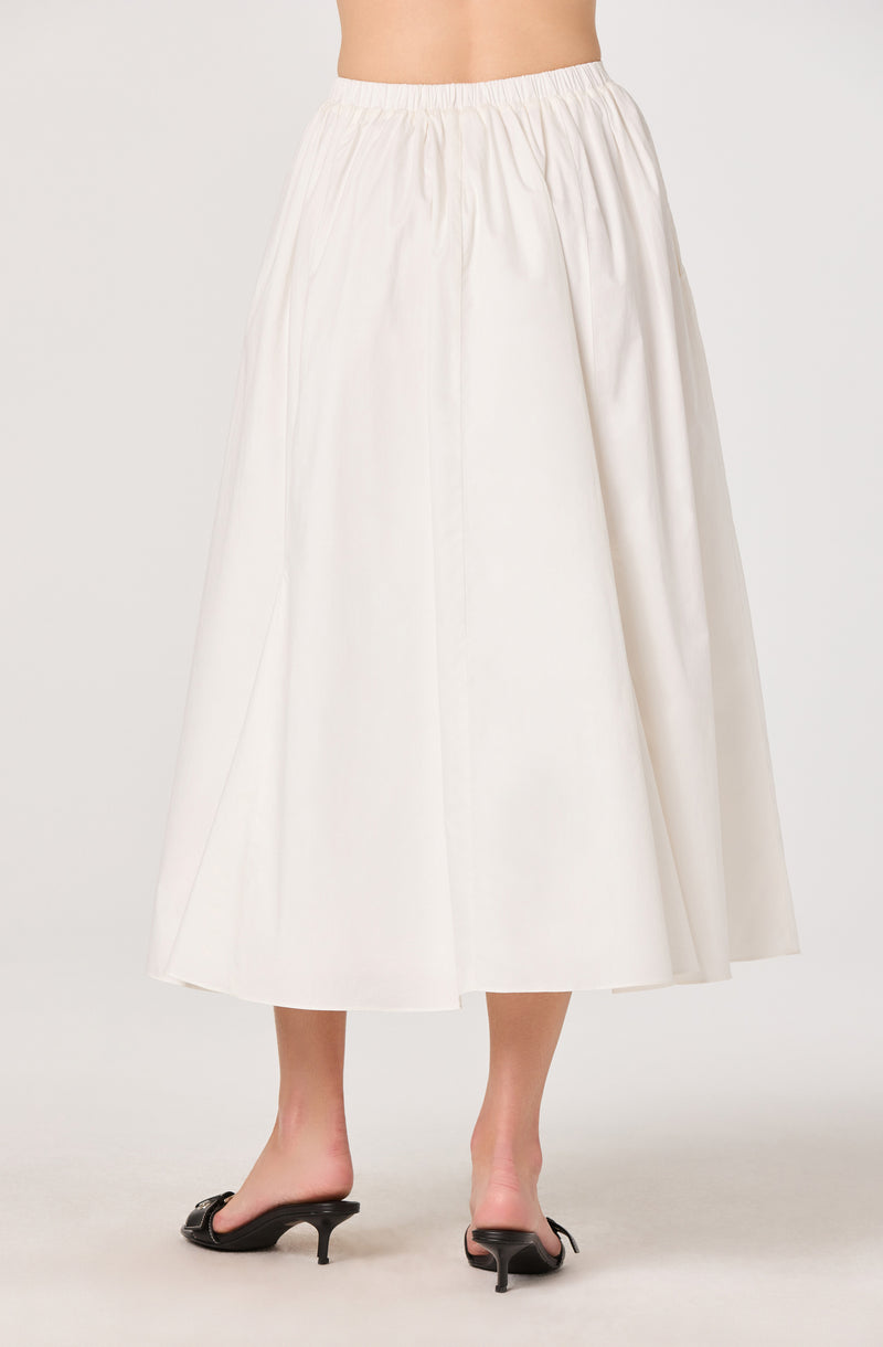 White, high-waisted, ankle-length skirt with a full, flowing silhouette.