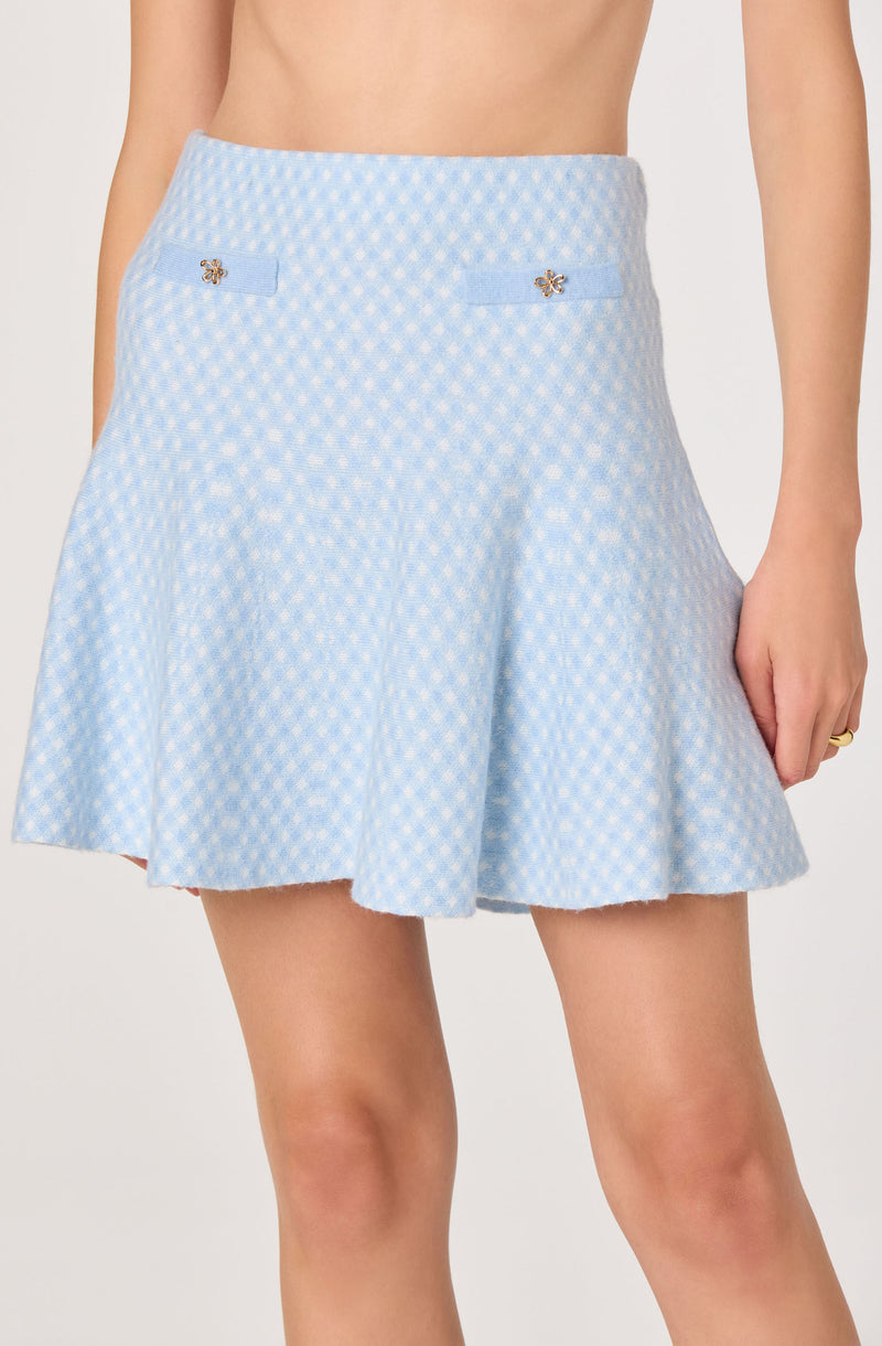 Light blue and white checkered skirt with two small bow embellishments near the waist.