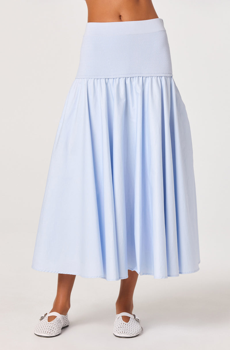 Light blue high-waisted midi skirt with a gathered, flowing design and a wide waistband.