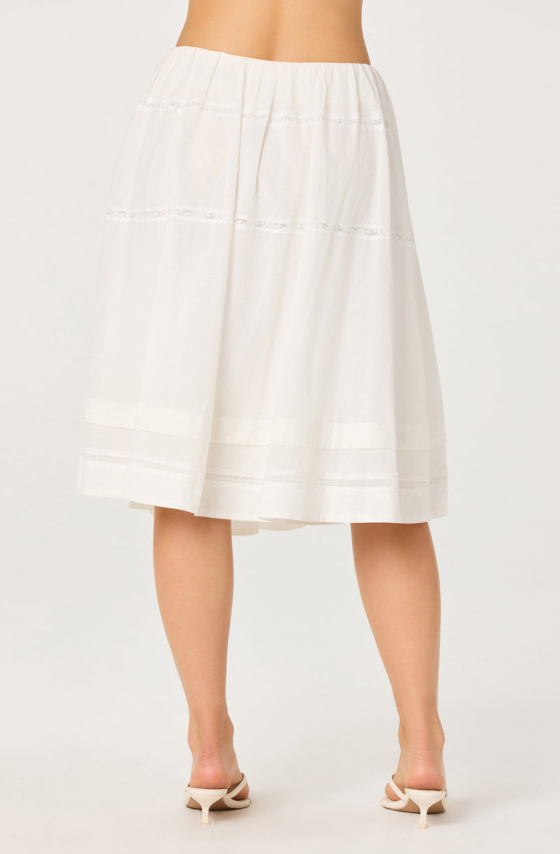 White midi skirt with horizontal lace inserts and pleats.