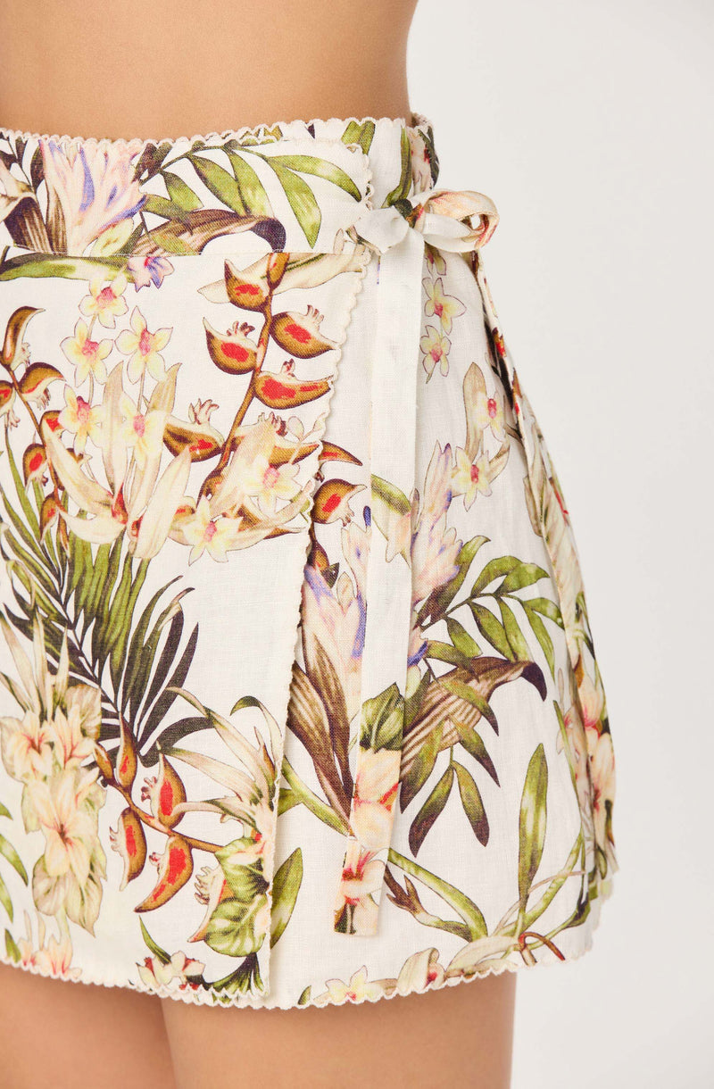 High-waisted floral shorts with a tie waist and colorful botanical print.