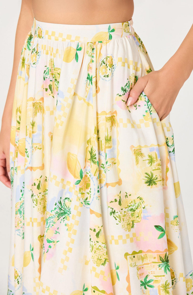 White skirt with a colorful, tropical botanical pattern and a pocket on the right.
