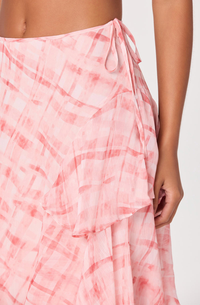 Pink and peach patterned wrap skirt with a tied bow at the waist.