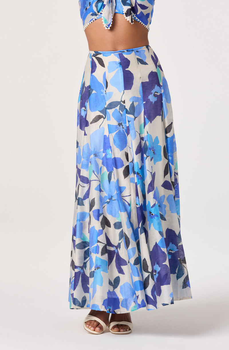 Long flowy skirt with a blue, purple, black, and green abstract floral print.