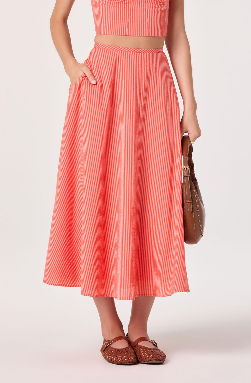 Coral and white vertically striped wide-leg skirt with pockets, paired with matching crop top.