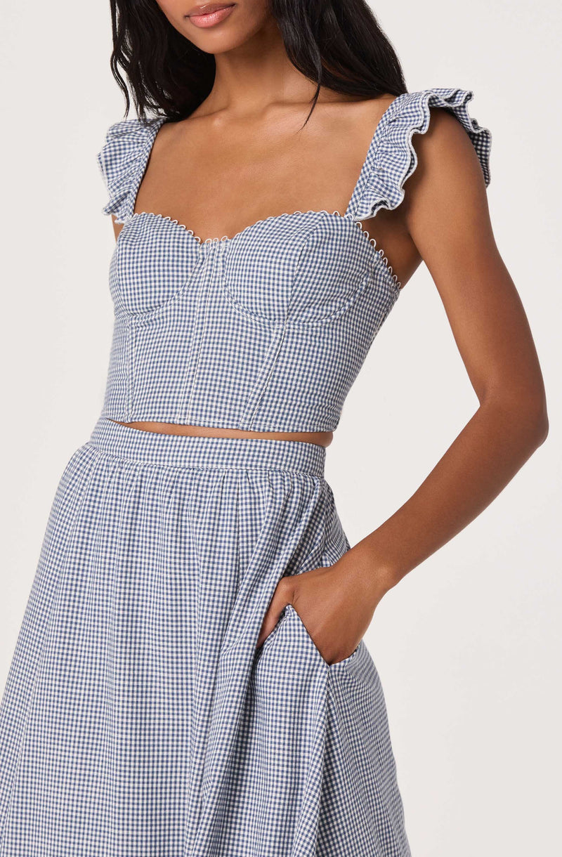 Blue and white gingham two-piece outfit with ruffled sleeves and a cropped top.