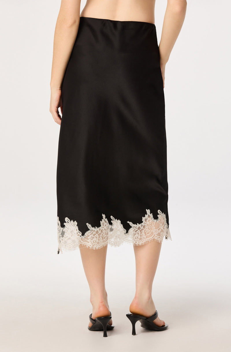 Black satin skirt with white lace trim at the hem.