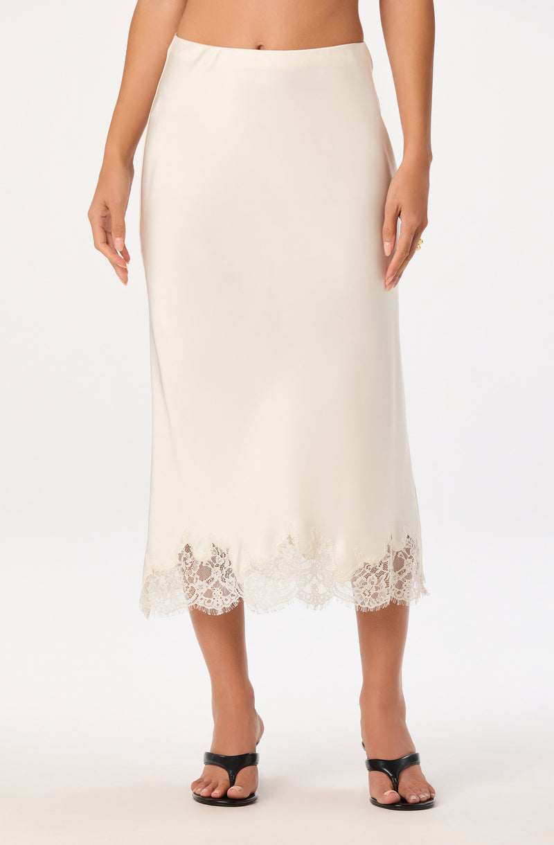 White midi skirt with lace hem detail.