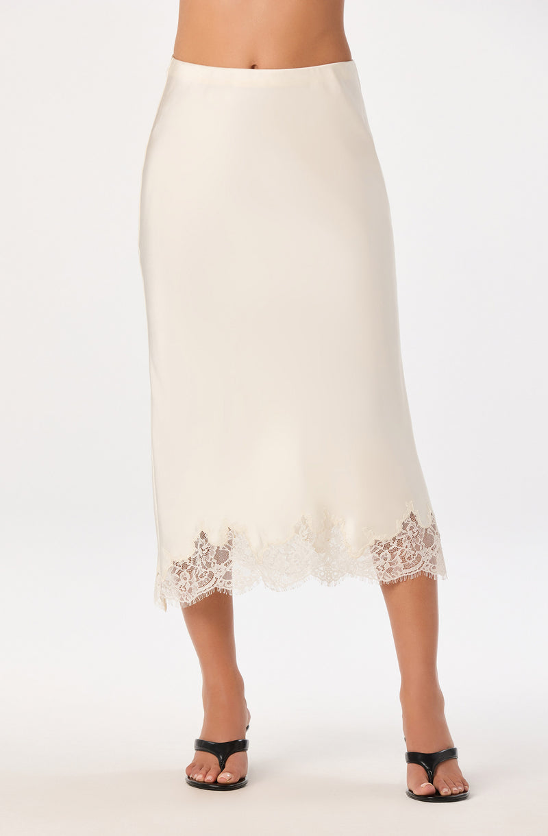 Cream-colored midi skirt with lace trim at the hem.