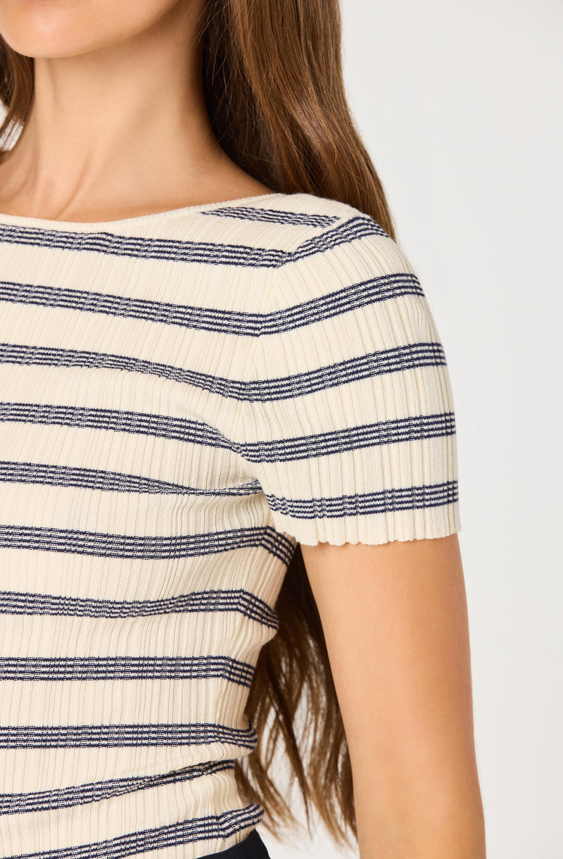 Cream ribbed knit top with navy horizontal stripes.