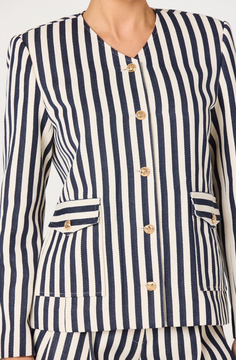 Navy and white vertically striped jacket with gold buttons and matching pocket flaps.