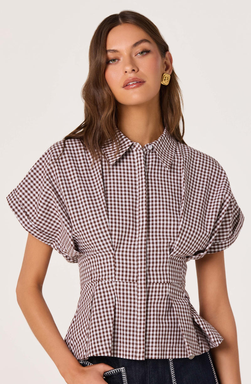 Gingham top with puffed short sleeves and a fitted waist.