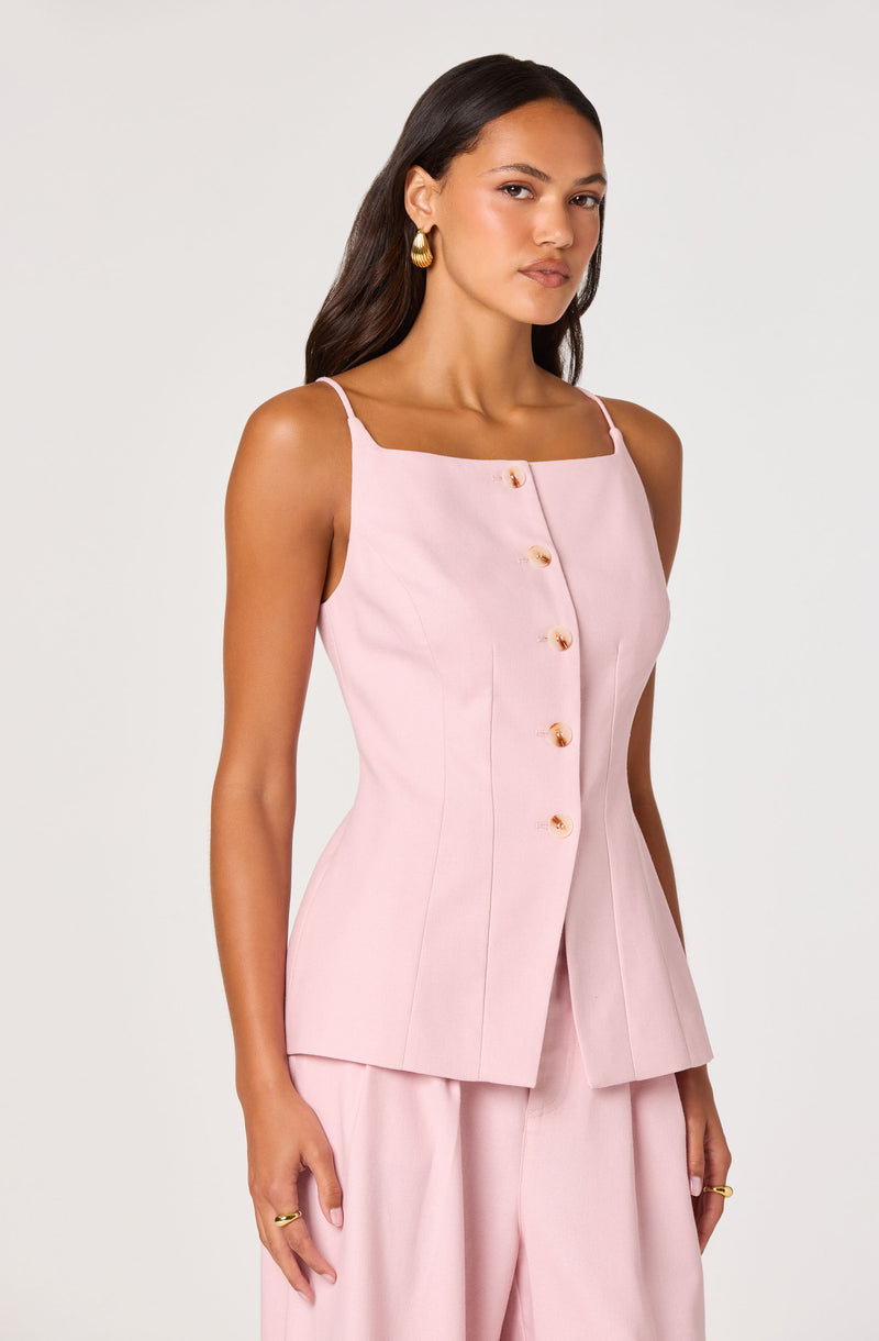 Light pink sleeveless top with thin straps, front button closure, and structured fit.