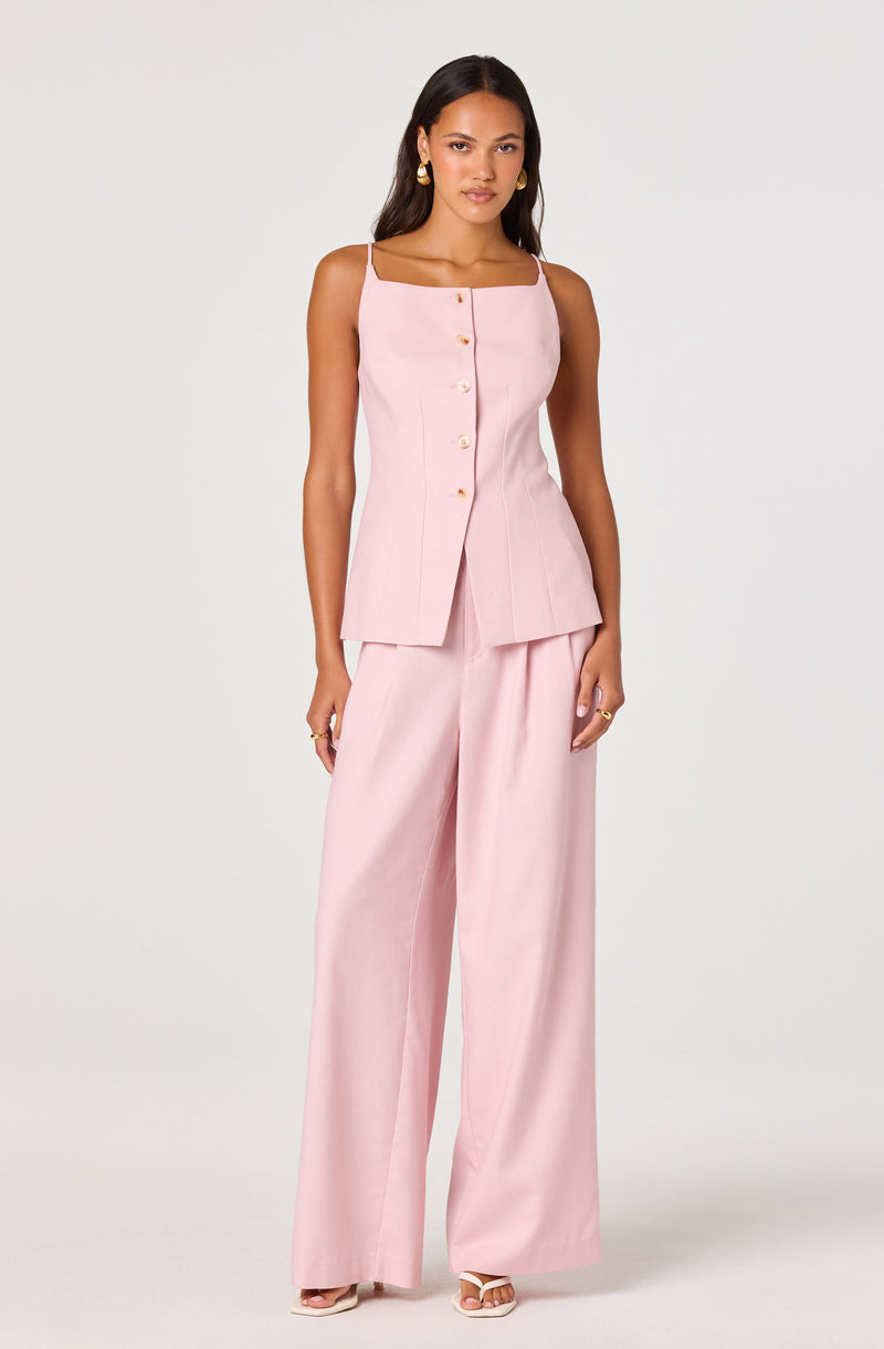 Light pink sleeveless top with buttons and wide-leg matching pants.