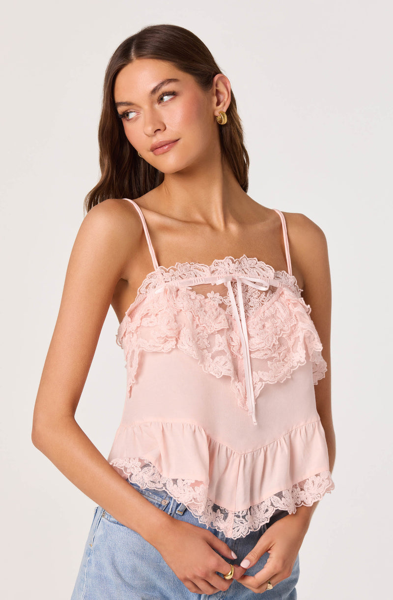 Pink lace-trimmed camisole with ruffles and spaghetti straps.