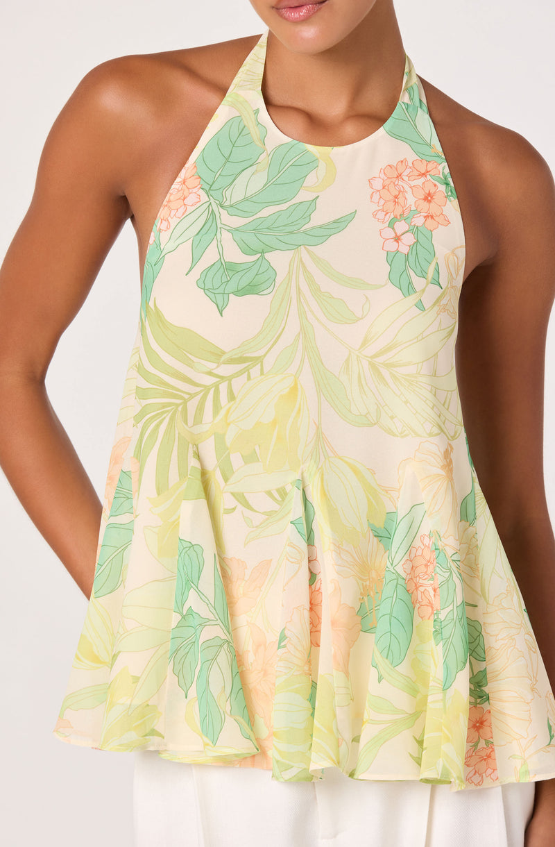 Sleeveless, flowy top with a floral and leafy print in pastel shades of green, yellow, and pink.