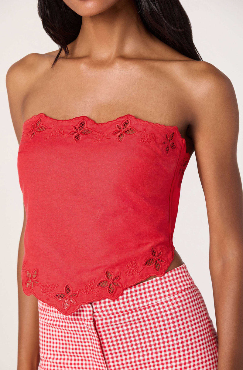 Red strapless top with embroidered butterfly details at the hem and neckline.