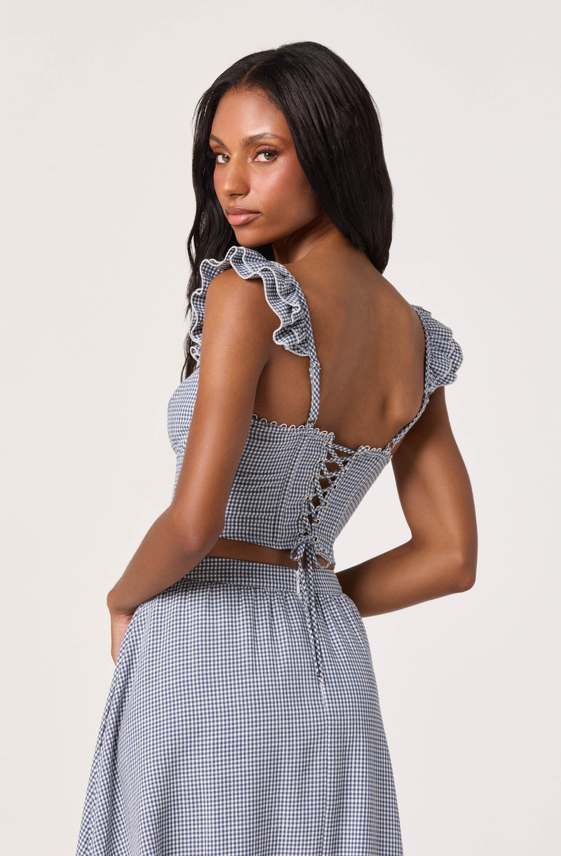 Gingham crop top with ruffled sleeves and lace-up back, paired with a matching skirt.