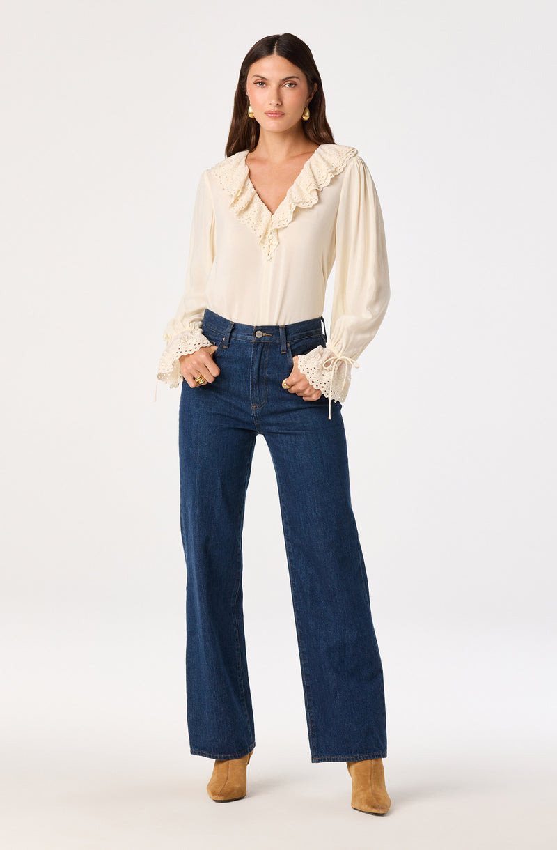 Cream-colored blouse with ruffled lace collar and lace-trimmed puffed sleeves.