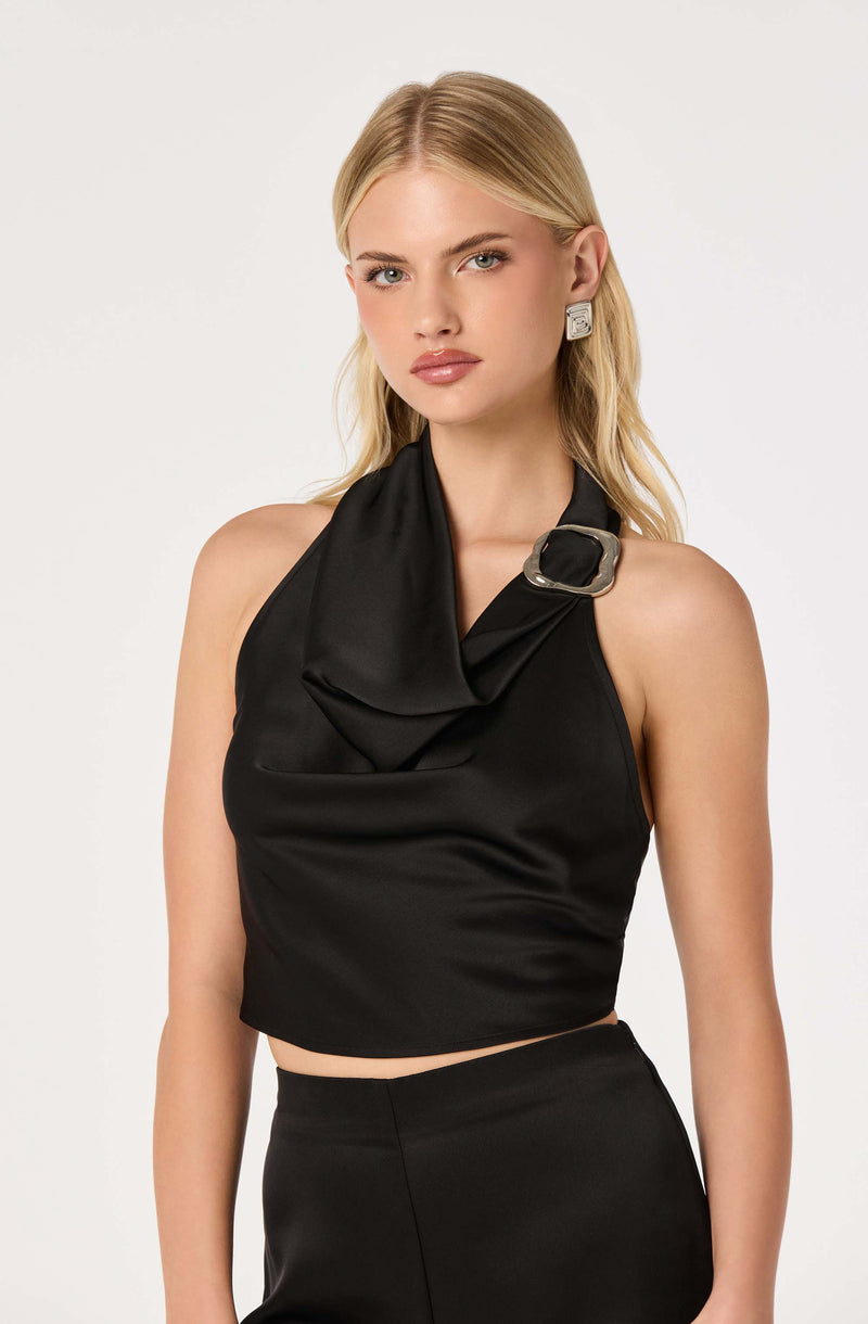 Black sleeveless top with a large satin collar and decorative buckle detail.