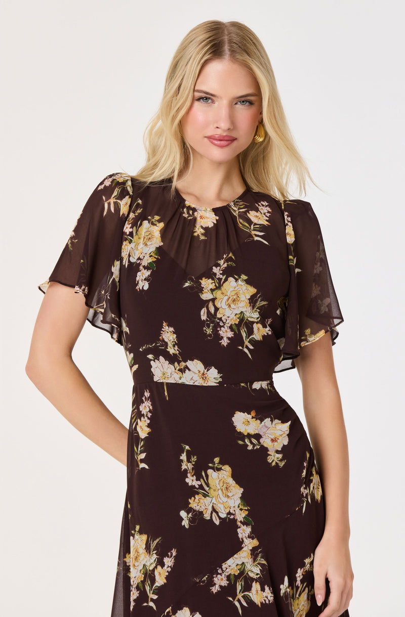 Black floral dress with short, sheer, ruffled sleeves and a fitted waist.