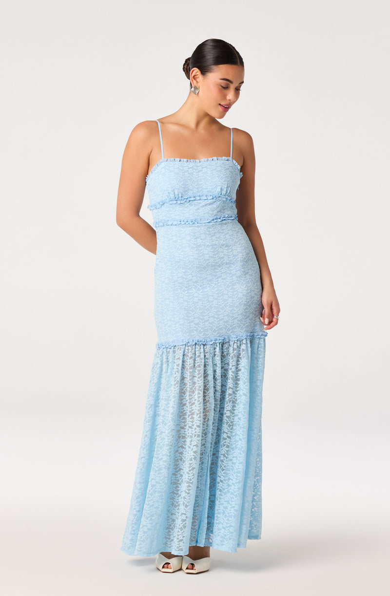 Light blue spaghetti strap dress with ruffled bodice and tiered, patterned skirt.