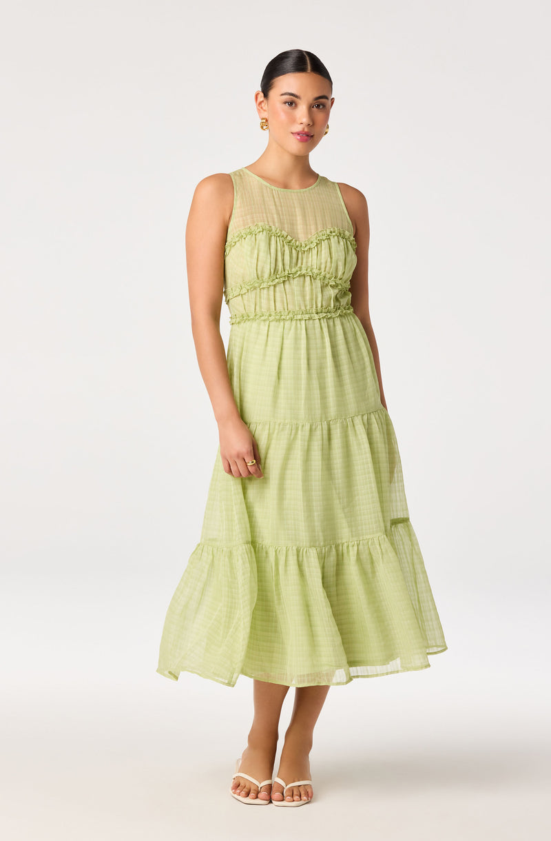 Light green sleeveless midi dress with ruffled details, fitted waist, and tiered skirt.