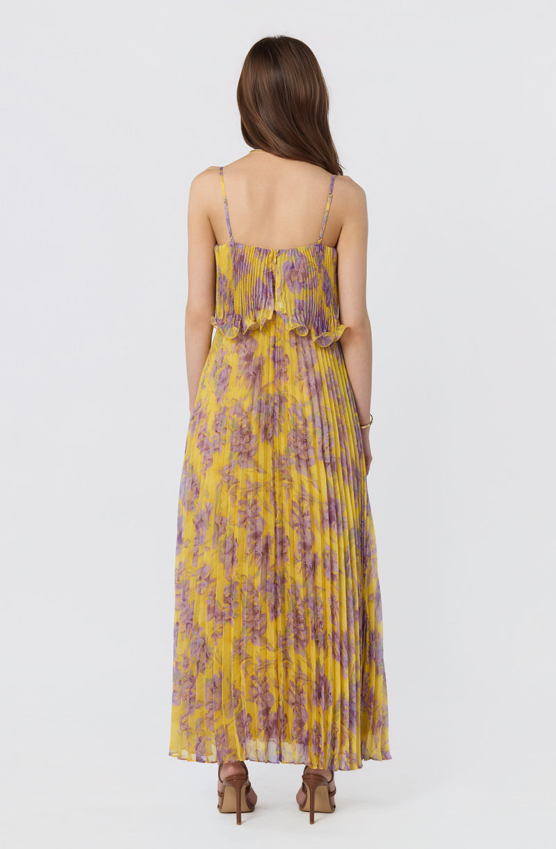 Yellow and purple floral maxi dress with thin straps and ruffled top.