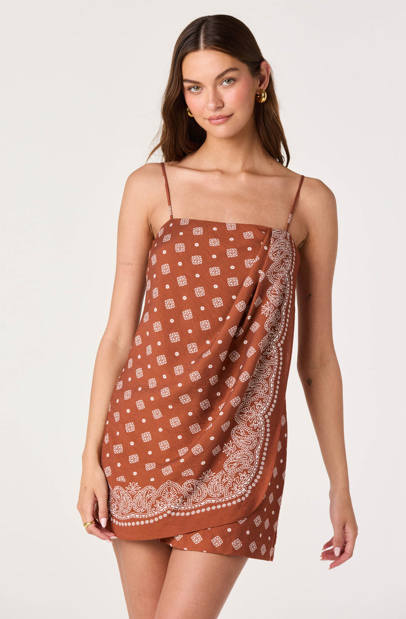 Brown dress with thin spaghetti straps, white paisley and geometric print.