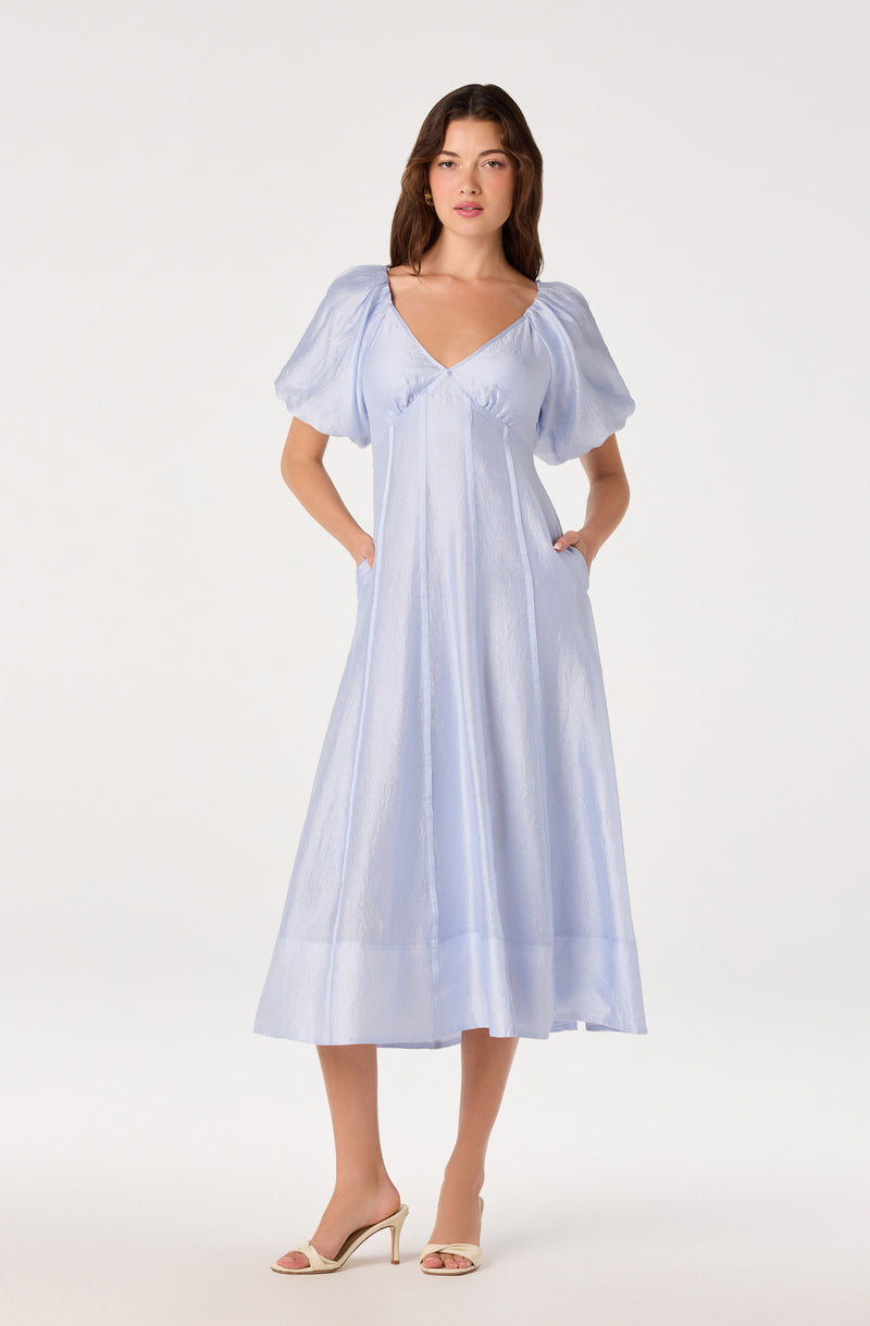 Light blue midi dress with puff sleeves, V-neckline, and a flowy A-line silhouette.