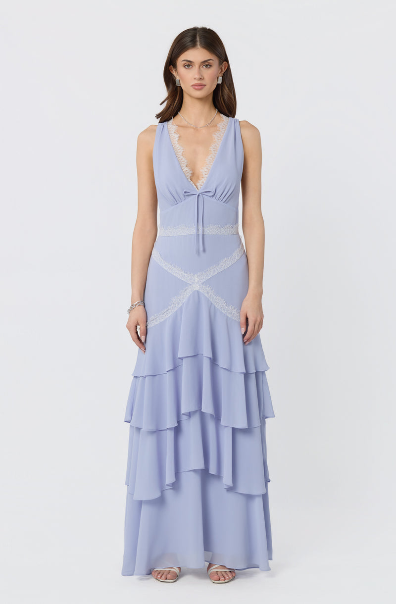 Light blue sleeveless dress with lace trim, deep V neckline, and tiered ruffled skirt.