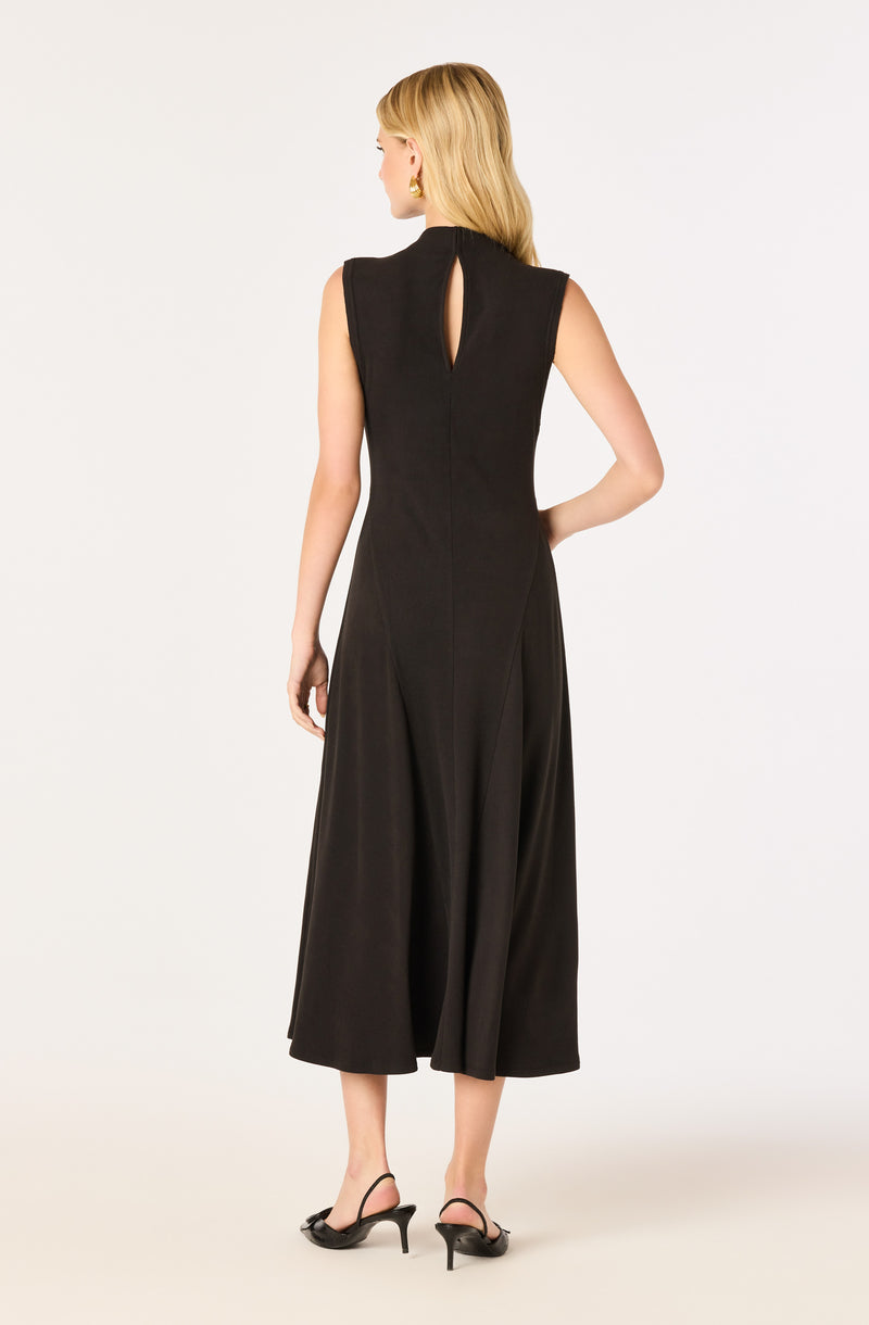 Back view of a woman in a sleeveless black jumpsuit with wide legs and a keyhole detail at the back.
