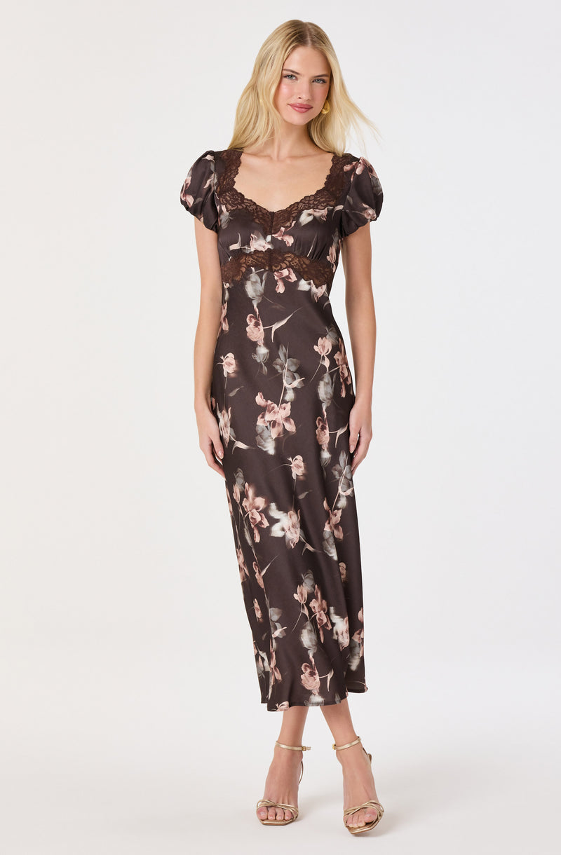 Black floral satin dress with lace detailing on the bodice and puffed short sleeves.