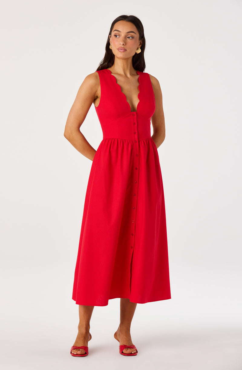Red sleeveless dress with scalloped neckline and button-down front.